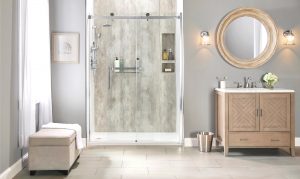 A low threshold shower with a built-in shelf and a glass door