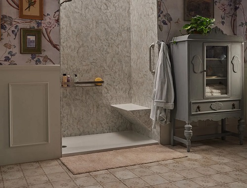 A walk-in shower with a bench seat. 