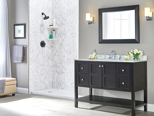A modern bathroom with a walk-in shower and dark gray craftsman style vanity. 