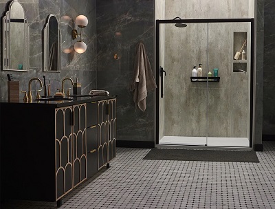 A modern bathroom with a walk-in shower, gray marbled walls, and a double vanity. 